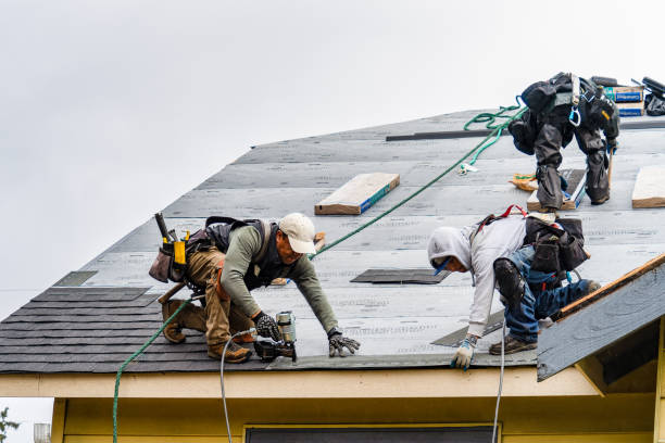 Professional Gutter Installation technician working in Morrisville, VT